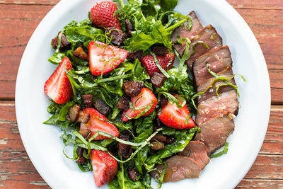 GRILLED BEEF HEART STEAK WITH SMOKED STRAWBERRIES AND BACON-WILTED SPINACH